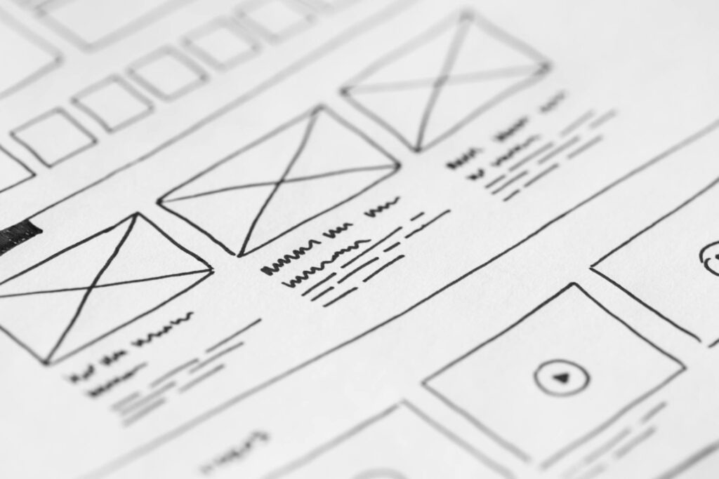 A picture of a hand-drawn website design wireframe.